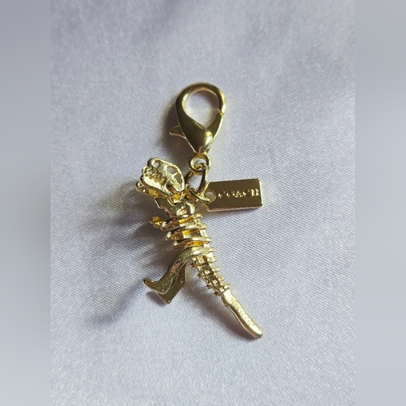 Coach Handbags - Coach Gold Rexy Bag Charm